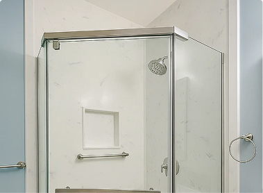 Glass corner shower with white marble walls